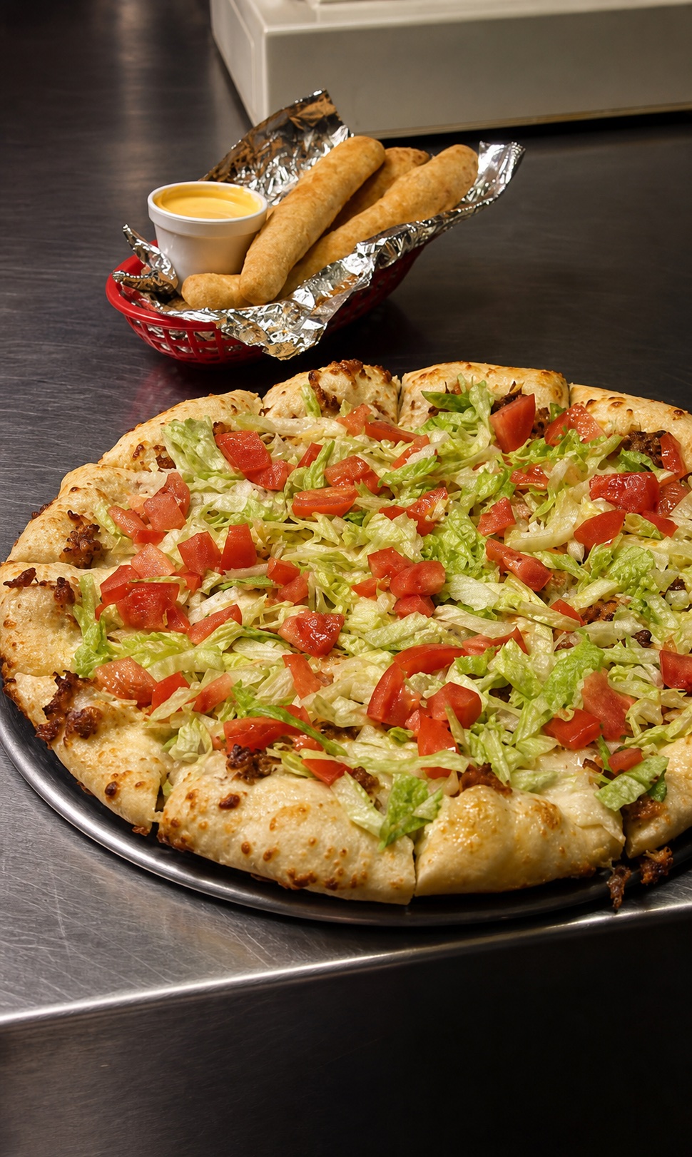 Taco pizza and breadsticks at Y-Not Pizza